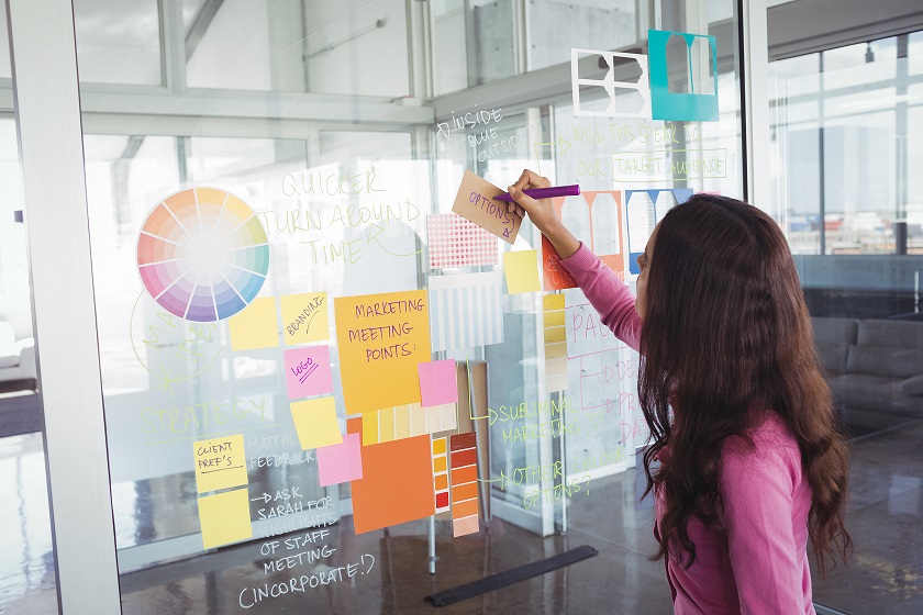 29459922_designer-making-strategy-on-glass-in-creative-office